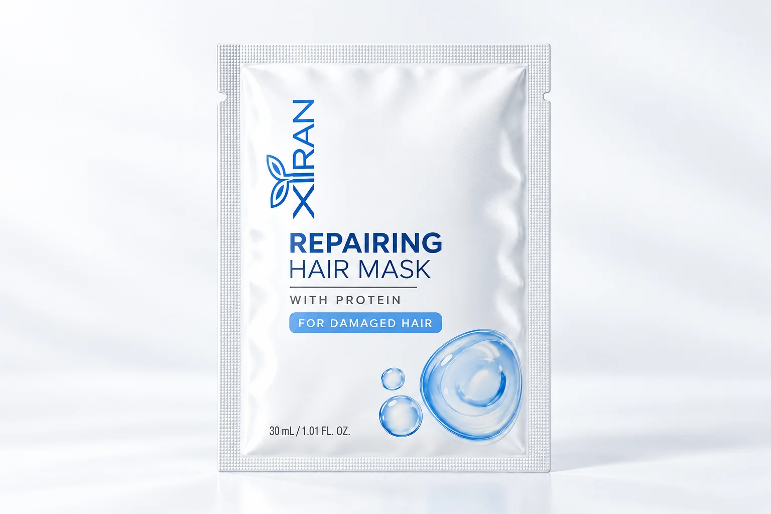 A single-use pouch of XIRAN repairing hair mask with protein, designed for treating damaged hair. White packaging with blue text.